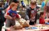 Arch Street Project booth with infamous chunks of dirt and future archaeologists. Photo by Don Groff.